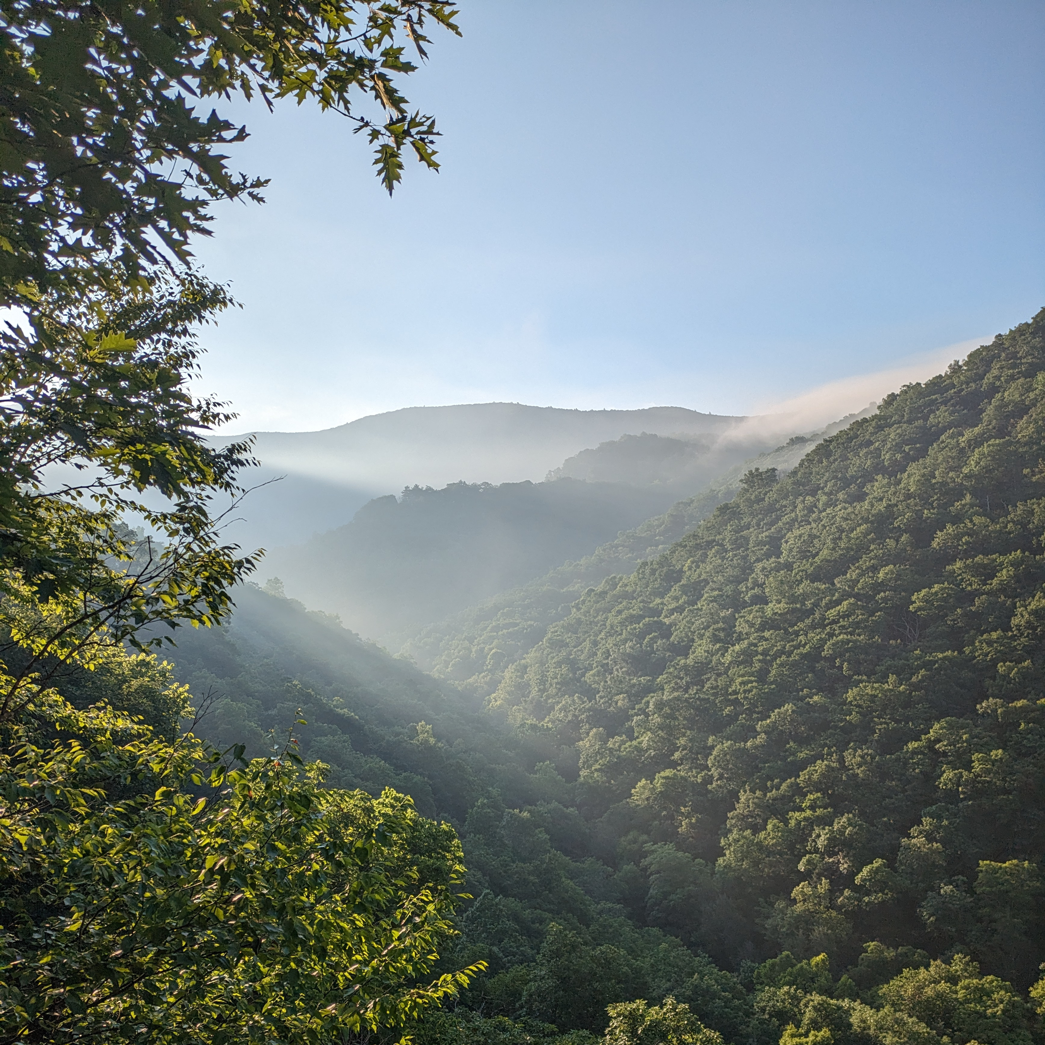 mountains with mist spilling over ridges